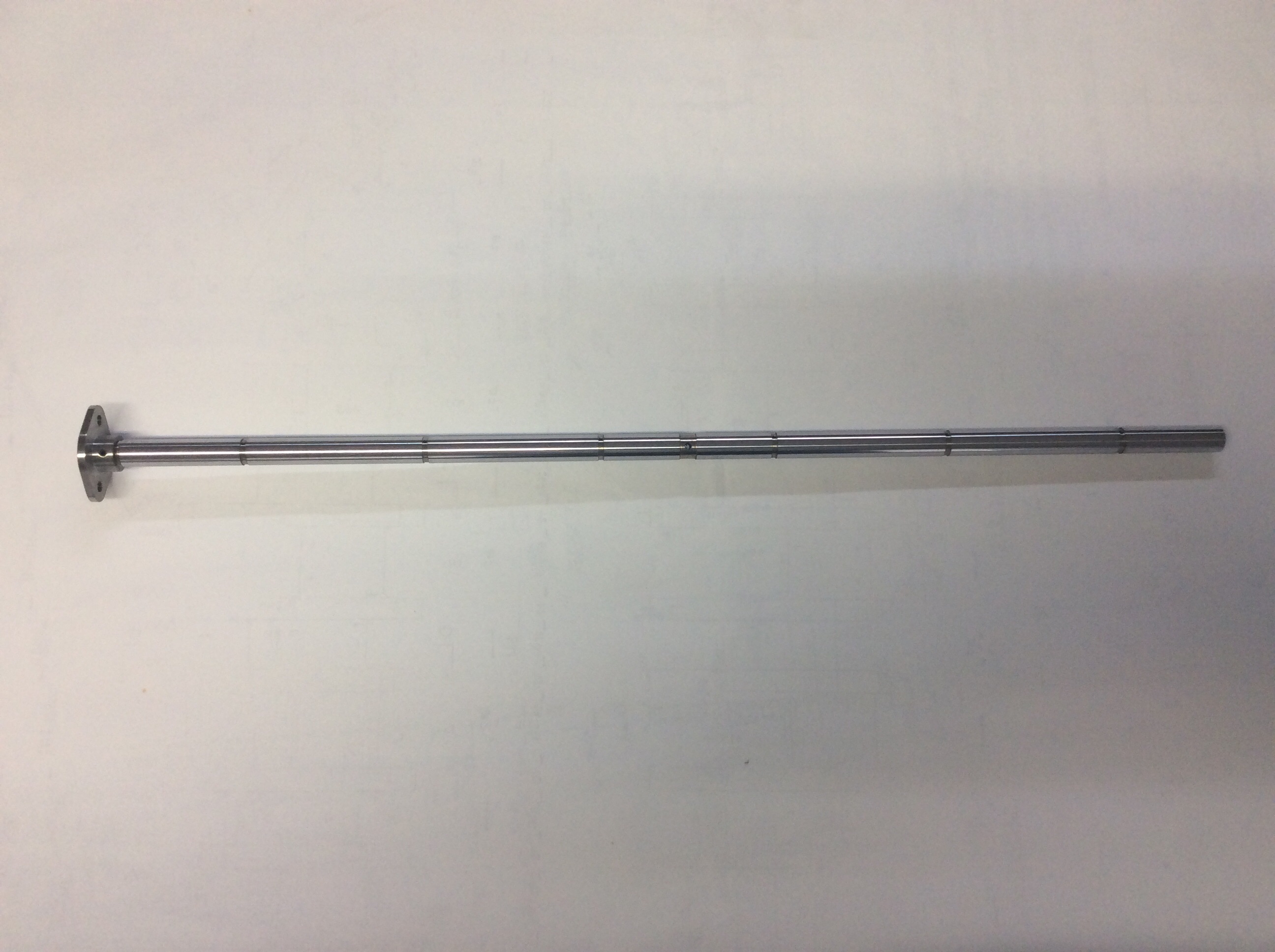 Rocker Shaft Including Flange
